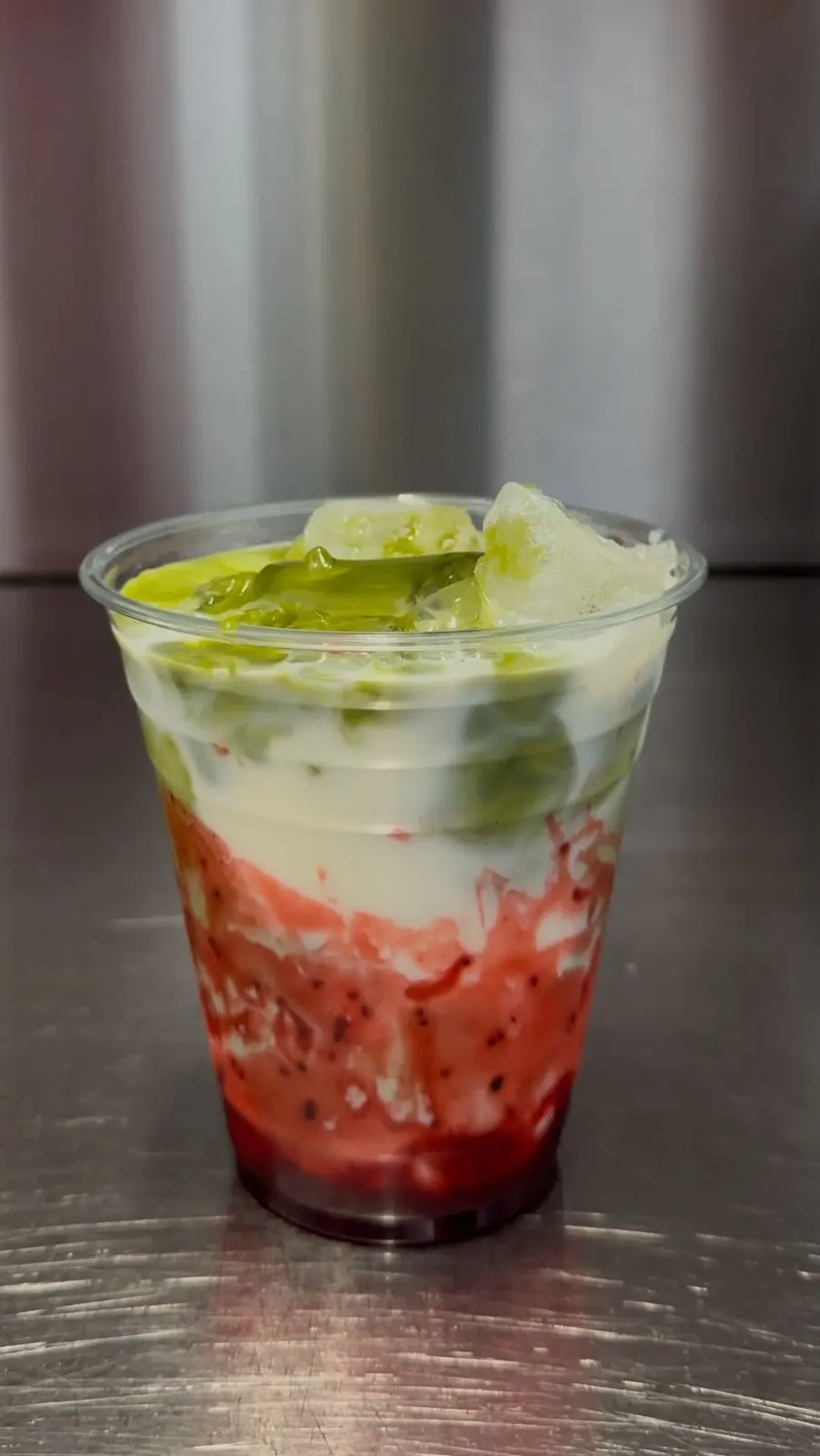 Strawberry matcha in a clear cup